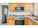 Features new stainless steel appliances and plenty of cabinet storage at 612 Ralph St, Auburndale, FL 33823