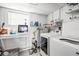 Laundry room with washer, dryer, dishwasher, and water heater at 612 Ralph St, Auburndale, FL 33823