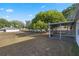 The backyard view of the home features a screened in porch and plenty of space at 6560 Horizon Point Dr, Lakeland, FL 33813