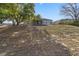 The view showcases a spacious backyard with large trees and a white picket fence at 6560 Horizon Point Dr, Lakeland, FL 33813