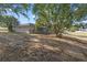 Spacious backyard with a fenced in area and trees at 6560 Horizon Point Dr, Lakeland, FL 33813