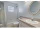 A bright bathroom includes a tub and shower, a toilet, and a vanity with a sink at 6560 Horizon Point Dr, Lakeland, FL 33813