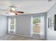 Large bedroom with windows and a ceiling fan at 6560 Horizon Point Dr, Lakeland, FL 33813