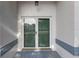 The home features a lovely glass paneled front door and neutral paint scheme at 6560 Horizon Point Dr, Lakeland, FL 33813
