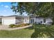 Charming front exterior with well-manicured lawn and two car garage at 6560 Horizon Point Dr, Lakeland, FL 33813