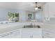 Kitchen view showing the counter, sink, dishwasher, and breakfast bar at 6560 Horizon Point Dr, Lakeland, FL 33813