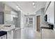 A well lit eat-in kitchen features white cabinets and appliances with a tiled floor at 6560 Horizon Point Dr, Lakeland, FL 33813
