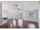 Bright living room featuring hardwood floors, a ceiling fan, and sliding glass doors to the outdoor space at 6560 Horizon Point Dr, Lakeland, FL 33813
