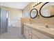 Main bathroom features a double sink vanity, walk in shower, and soaking tub at 6560 Horizon Point Dr, Lakeland, FL 33813