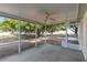 A screened porch with a ceiling fan has views of the backyard at 6560 Horizon Point Dr, Lakeland, FL 33813