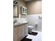 Bathroom features white cabinetry, neutral walls, and tile flooring at 670 Avenue N Se, Winter Haven, FL 33880