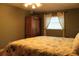 Comfortable bedroom with a ceiling fan and ample natural light at 670 Avenue N Se, Winter Haven, FL 33880