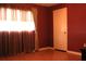 Bedroom featuring a window with curtains and red colored walls at 670 Avenue N Se, Winter Haven, FL 33880