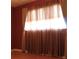 Bedroom featuring a window with curtains and red colored walls at 670 Avenue N Se, Winter Haven, FL 33880
