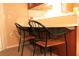 Bright breakfast nook featuring 2 chairs and overhead cabinets at 670 Avenue N Se, Winter Haven, FL 33880