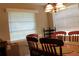 Inviting dining area with natural light and a table set for a meal at 670 Avenue N Se, Winter Haven, FL 33880