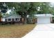 Charming one-story brick home featuring an attached garage and a well-manicured front lawn at 670 Avenue N Se, Winter Haven, FL 33880
