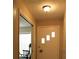 Bright hallway with a paneled front door and a glimpse into another room at 670 Avenue N Se, Winter Haven, FL 33880