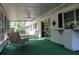 Spacious screened-in porch with ceiling fans at 670 Avenue N Se, Winter Haven, FL 33880
