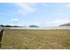 Expansive backyard surrounded by a pristine white fence, perfect for outdoor activities and privacy at 730 Colville Pl, Kissimmee, FL 34759
