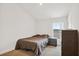 Cozy bedroom with neutral tones, a window with blinds, and a spacious closet at 730 Colville Pl, Kissimmee, FL 34759