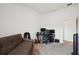 Guest room featuring a futon and office space at 730 Colville Pl, Kissimmee, FL 34759