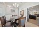 Open dining room area with elegant decor and seamless access to the adjacent kitchen at 730 Colville Pl, Kissimmee, FL 34759