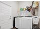 Functional laundry room with modern washer and dryer at 730 Colville Pl, Kissimmee, FL 34759