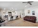 Open living space with comfortable seating, adjacent dining area, and hardwood-style flooring at 730 Colville Pl, Kissimmee, FL 34759