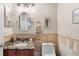 Cozy bathroom with travertine tile, granite countertop, and decorative finishes creates a charming space at 780 Gila Dr, Kissimmee, FL 34759