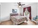 Comfortable bedroom with ceiling fan, plush carpeting and a serene, relaxing color scheme at 780 Gila Dr, Kissimmee, FL 34759