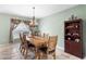 Charming dining room featuring tile floors, a chandelier, and light-filled windows at 780 Gila Dr, Kissimmee, FL 34759