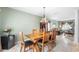 Charming dining room featuring tile floors, a chandelier, and light-filled windows at 780 Gila Dr, Kissimmee, FL 34759