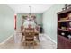 Charming dining room featuring tile floors, a chandelier, and light-filled windows at 780 Gila Dr, Kissimmee, FL 34759