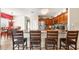 Kitchen view with breakfast bar, stainless appliances, view into the dining and living areas at 780 Gila Dr, Kissimmee, FL 34759