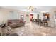 Open-concept living room with views of the kitchen and dining area; tile floor throughout at 780 Gila Dr, Kissimmee, FL 34759