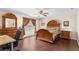 Elegant main bedroom with hardwood floors, decorative furniture, and a serene atmosphere at 780 Gila Dr, Kissimmee, FL 34759