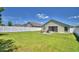 Spacious backyard with lush lawn and a white privacy fence, perfect for outdoor enjoyment at 8243 Campbell Crossing Cir, Lakeland, FL 33810