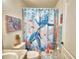 Bathroom featuring turtle themed shower curtain, decor and coordinating towels at 8243 Campbell Crossing Cir, Lakeland, FL 33810