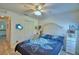 Cozy bedroom featuring a turtle-themed bedspread, ceiling fan, and closet at 8243 Campbell Crossing Cir, Lakeland, FL 33810