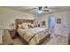 Inviting main bedroom with a large bed, en-suite bathroom, and decorative wall accents at 8243 Campbell Crossing Cir, Lakeland, FL 33810