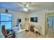 Bright home office featuring a large window, comfortable seating, and modern decor at 8243 Campbell Crossing Cir, Lakeland, FL 33810