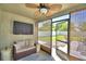 Relaxing sunroom featuring comfortable seating, stylish decor, and access to the backyard at 8243 Campbell Crossing Cir, Lakeland, FL 33810