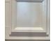 Close up of the shaker style cabinets with white paint, which are a design element in the home at 825 Grazie Loop, Davenport, FL 33837
