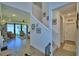 Foyer with staircase, tile floors, and views into the living room at 825 Grazie Loop, Davenport, FL 33837