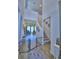 Spacious foyer with tall ceilings, staircase, neutral paint, and tile flooring that provides a welcoming entryway at 825 Grazie Loop, Davenport, FL 33837