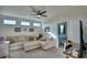 Upstairs loft area featuring neutral paint, comfortable seating, and plenty of natural light at 825 Grazie Loop, Davenport, FL 33837