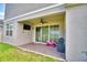 Covered patio with an outdoor ceiling fan, offering a comfortable space for outdoor enjoyment at 825 Grazie Loop, Davenport, FL 33837