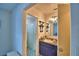 A bathroom featuring bright vanity and a shower with bright shower curtain at 842 Cinnamon Dr, Winter Haven, FL 33880