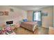 Cozy bedroom features a comfortable bed, light-filled window and neutral walls for a relaxing space at 842 Cinnamon Dr, Winter Haven, FL 33880